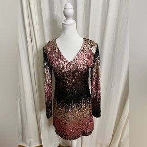 This sequin dress has shades of pink , black, brown